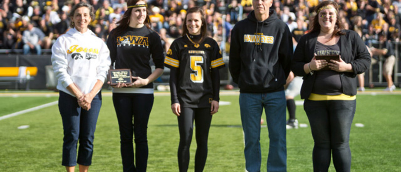 Rich and Patti Schmitz, of Waterloo, are recognized as Dad and Mom of the Year at half-time of the Nov. 10 Iowa football game