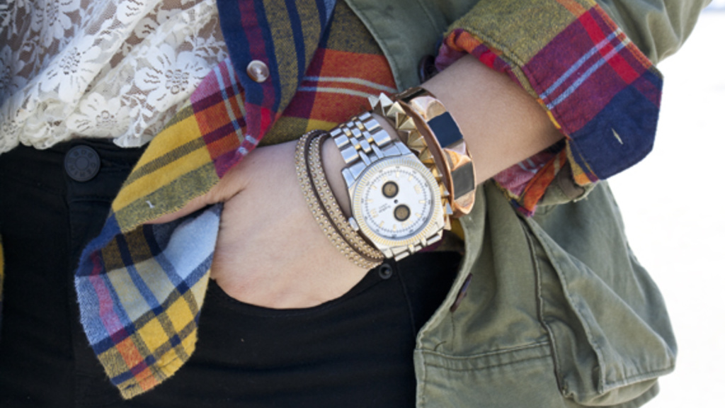a close up image of a fashion watch and bracelet worn by Lisa, who  is a senior at the University of Iowa studying journalism and graphic design. In her free time she enjoys doing yoga and reading fashion magazines. Lisa loves sporting a bright colored li