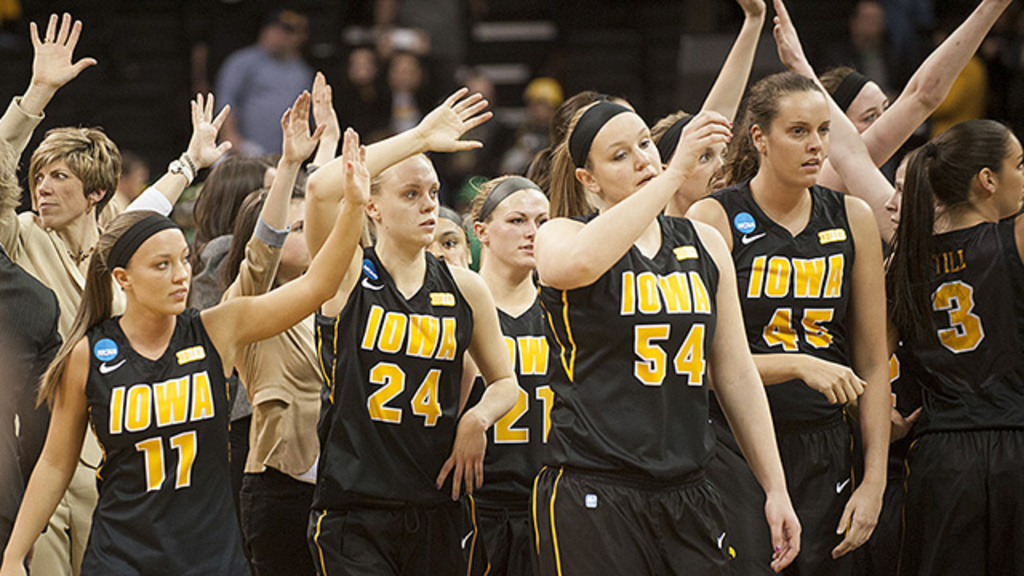 Iowa women's basketball team waves to the crowd after the game