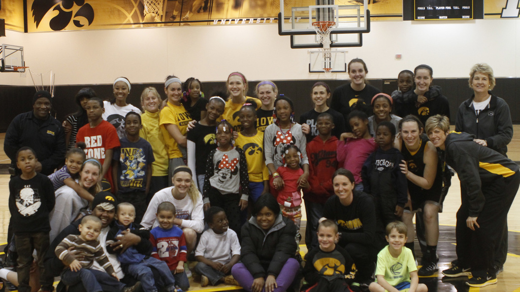 Children with the Iowa women's basketball team