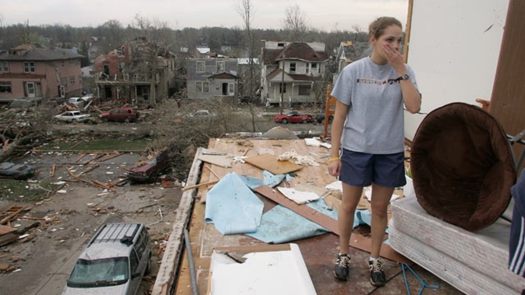 University of Iowa sophomore Jessica Fischels stands in the remains of her apartment in Iowa City, Iowa, April 14, 2006, after it was destroyed by tornado. (Matthew Holst/Iowa City Press Citizen/AP Photo)