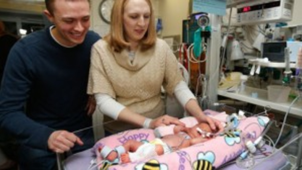 Daniel and Alicia Ames of Cambridge, Ill., visit their baby girl, Noelle, on Monday, Dec. 3, 2012, in the neonatal intensive care unit at University of Iowa Hospitals and Clinics in Iowa City. (Brian Ray/The Gazette)
