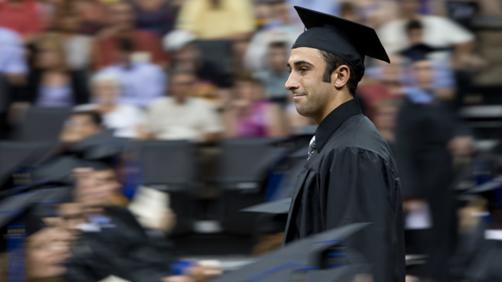 A graduate at Tippie College of Business commencement