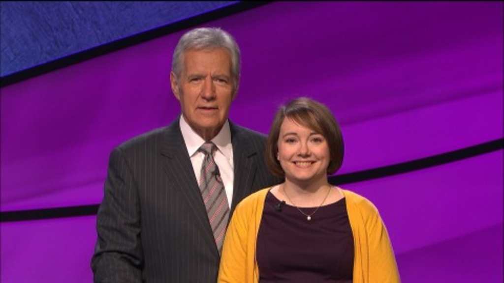 Jeopardy! champion Sarah McNitt, pictured with host Alex Trebek, returns Thursday for the Tournament of Champions semi-finals. Photo courtesy of Jeopardy!