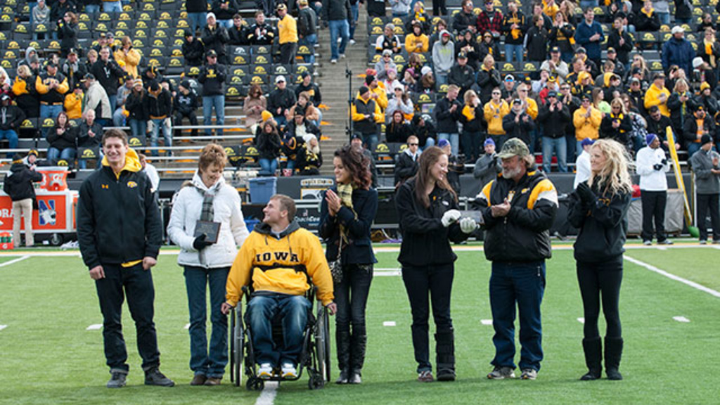 Mom and Dad of the Year presentation at Kinnick Stadium