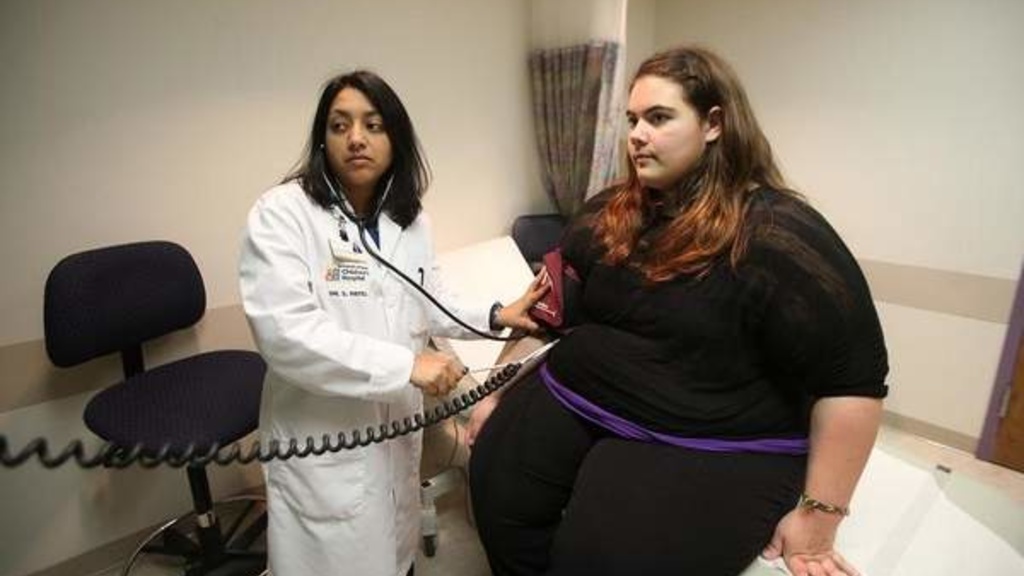 Dr. Sonali Patel of University of Iowa Hospitals and Clinics takes Journey Yeggy&#039;s blood pressure during a scheduled visit April 12.  Photo by Bryon Houlgrave/The Register.