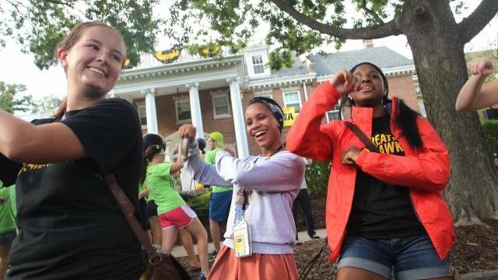 UI students bust a move in front of UI President Sally Mason&#039;s residence during the President&#039;s Block Party as part of On Iowa! activities.