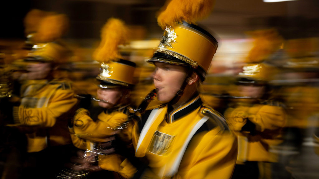 The UI Marching Band makes its way along the route during the 2022 Homecoming parade.