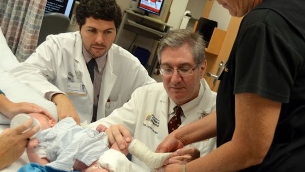 A team of UI researchers use the Ponseti treatment to place an Ioa Brace on a young clubfoot patient.