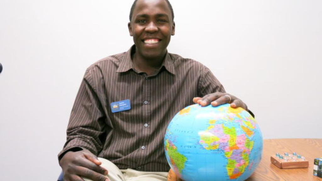 Zadok Nampala sits by a globe