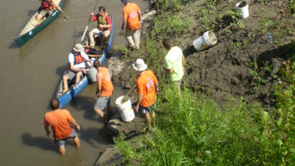 canoeists and event staff participate in the Project AWARE team that cleaned up the East and West Nishnabotna Rivers during 2010.