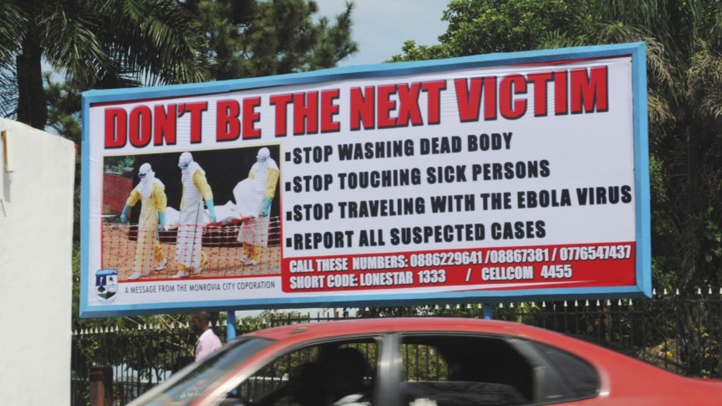 A billboard in Liberia&#039;s capital Monrovia offers advice on how to halt the spread of Ebola. (Source: PRI)