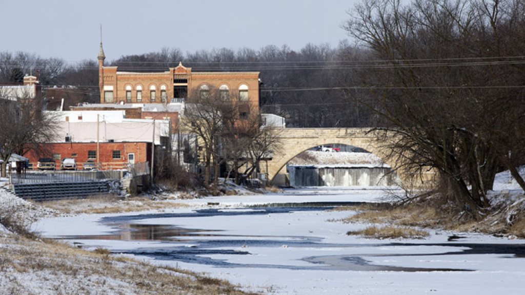 The Turkey River runs through Elkader, beneath the Keystone Arch Bridge, on Wednesday, Jan. 23, 2013. The river has flooded several times in recent decades, including a high water level more than 15 feet over flood stage in 2008. The bridge is the longest