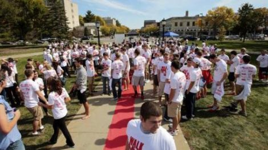 Men don high heels in a University of Iowa fund-raising walk to end sexual violence