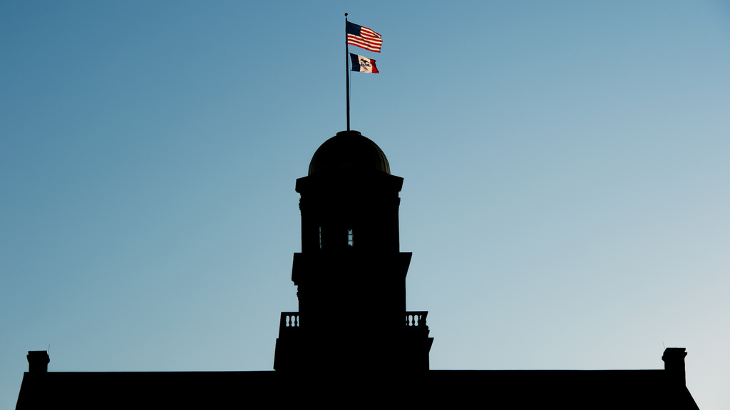 old capitol silhouette with flags visible