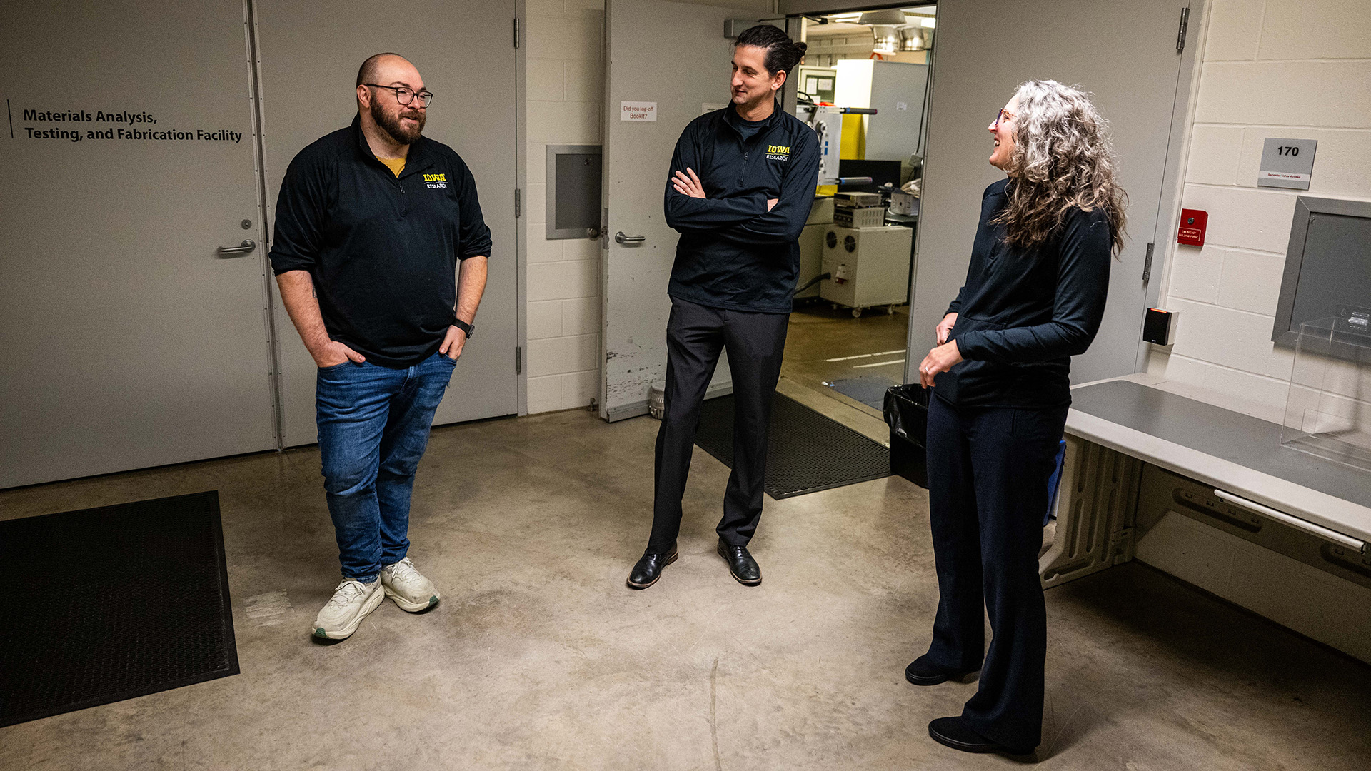 three people in a research facility