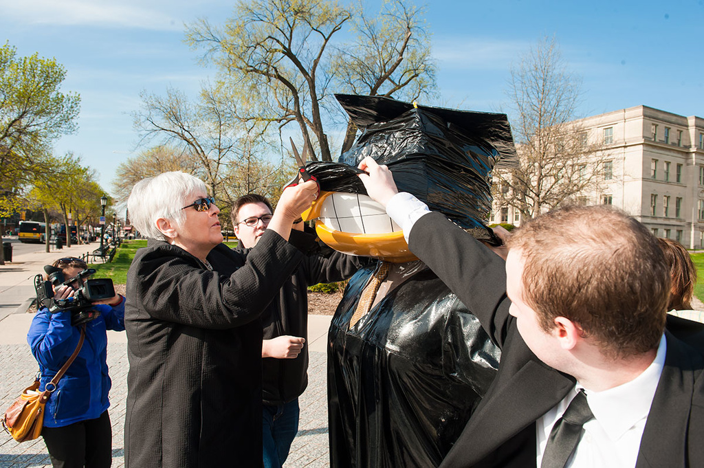 Sally Mason helps with the unveiling of Graduation Herky