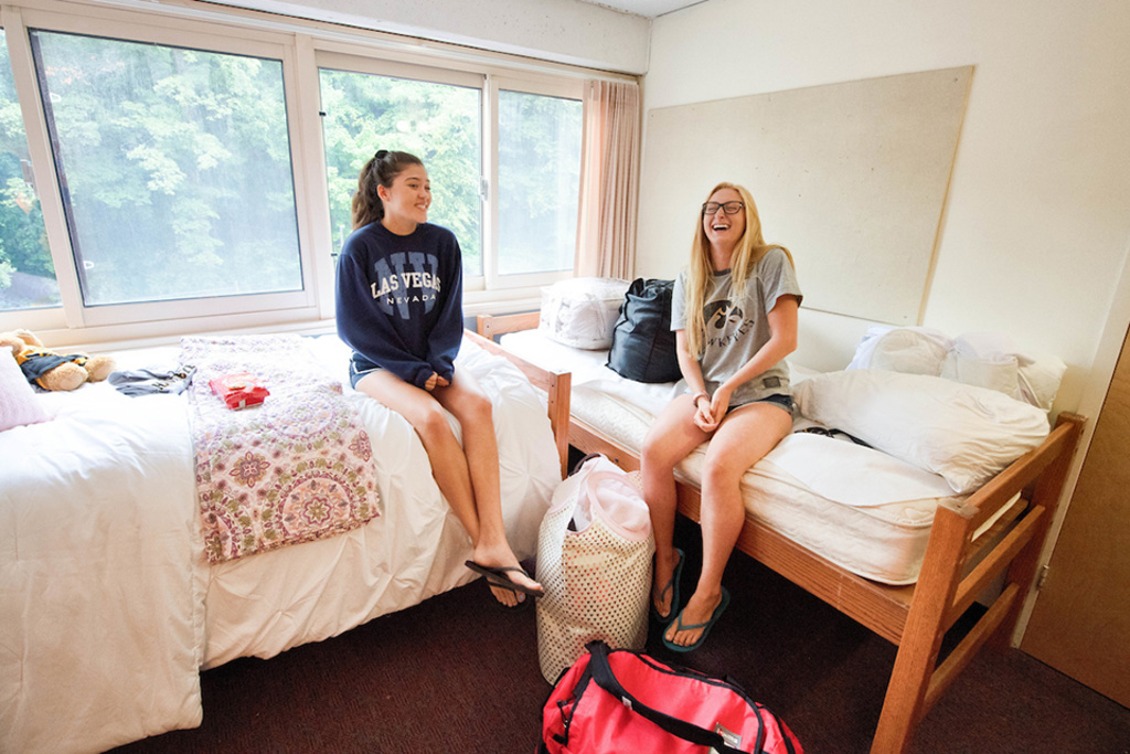 two women talking in residence hall room