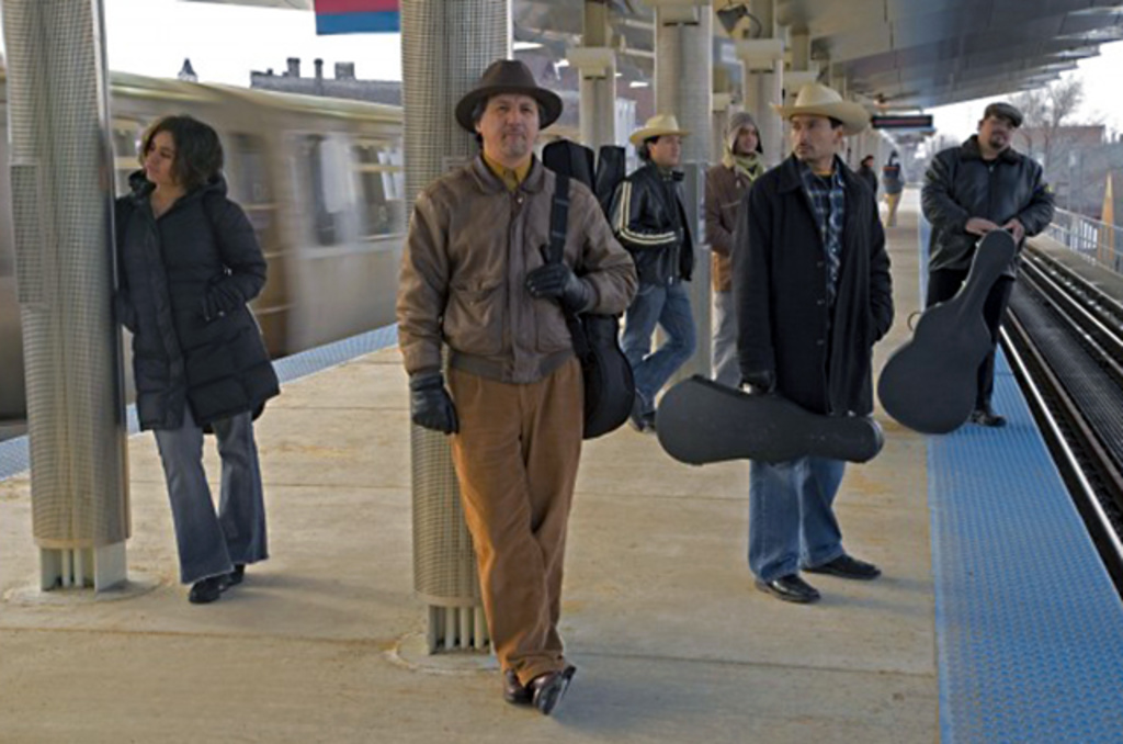 Sons of Mexico band members on train platform