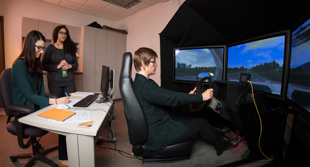 students working on driving simulator