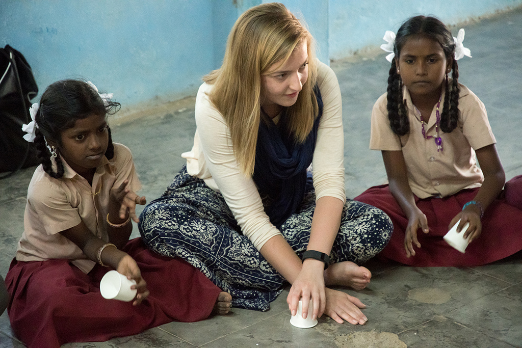 ui student interacting with children in india