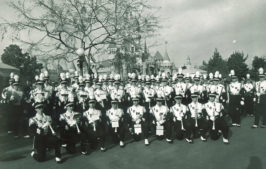 Black and white image of UI marching band posing at Disneyland in 1959.