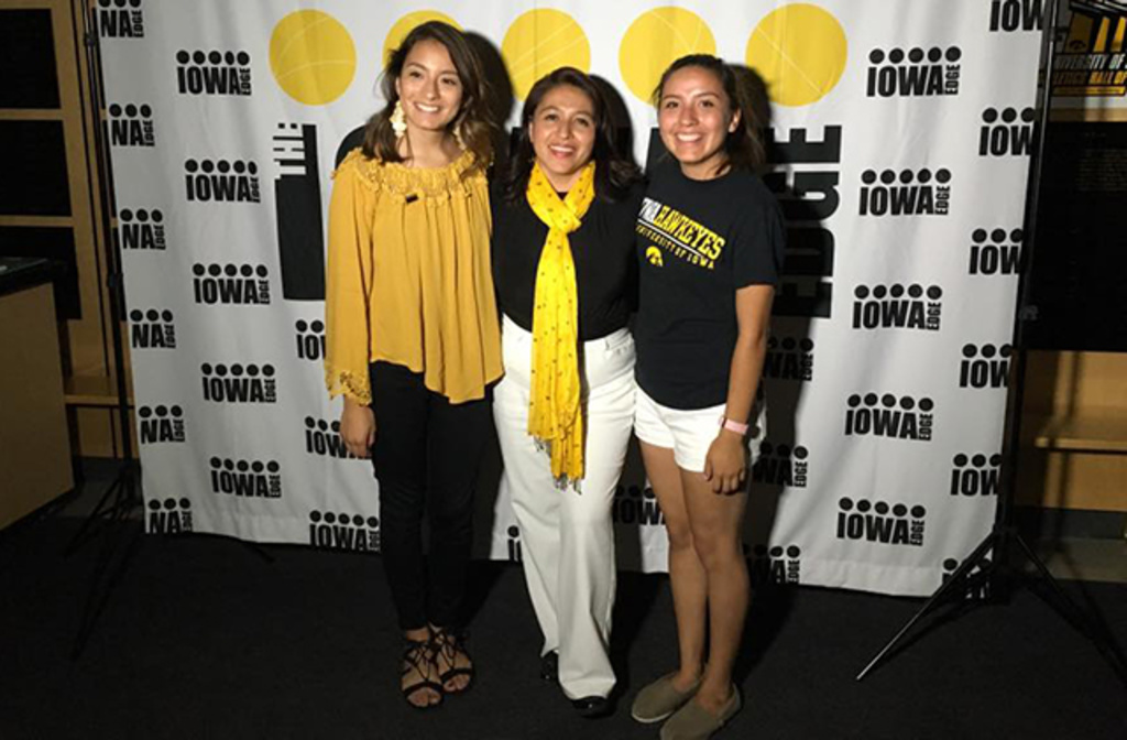 three women standing before iowa edge backdrop