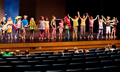 Participants in the Osage Summer Theatre Program finish their dress rehearsal and prepare to take a bow.