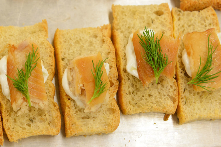 Pieces of fish on bread.