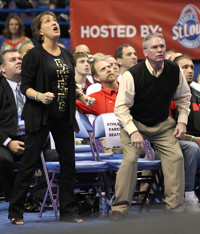 Matt McDonough's parents, Sandi and Michael, rise to their feet as their son competes in the NCAA Championships.
