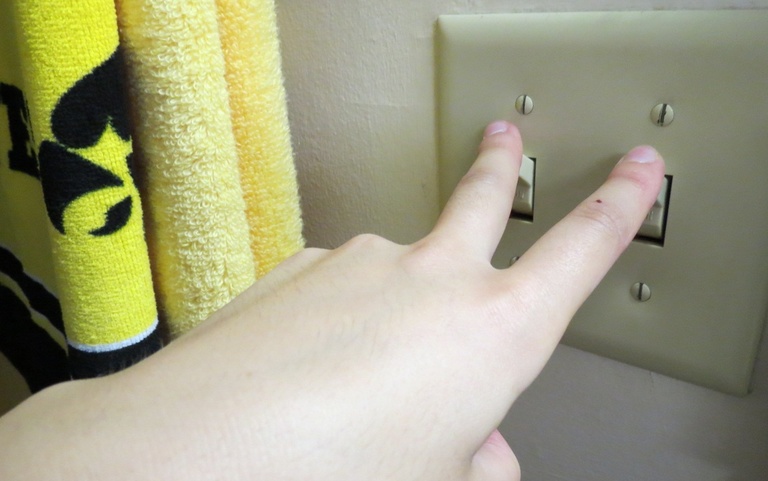 Fingers turning off light switches