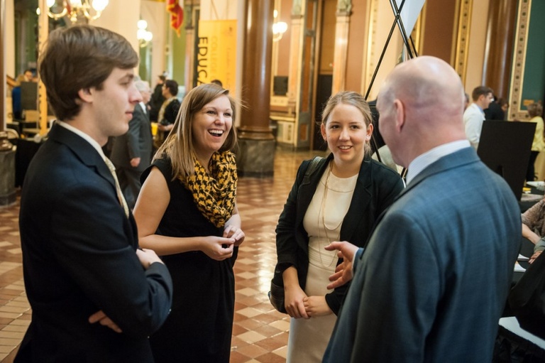 Group of UI students chat in the Capitol Rotunda.