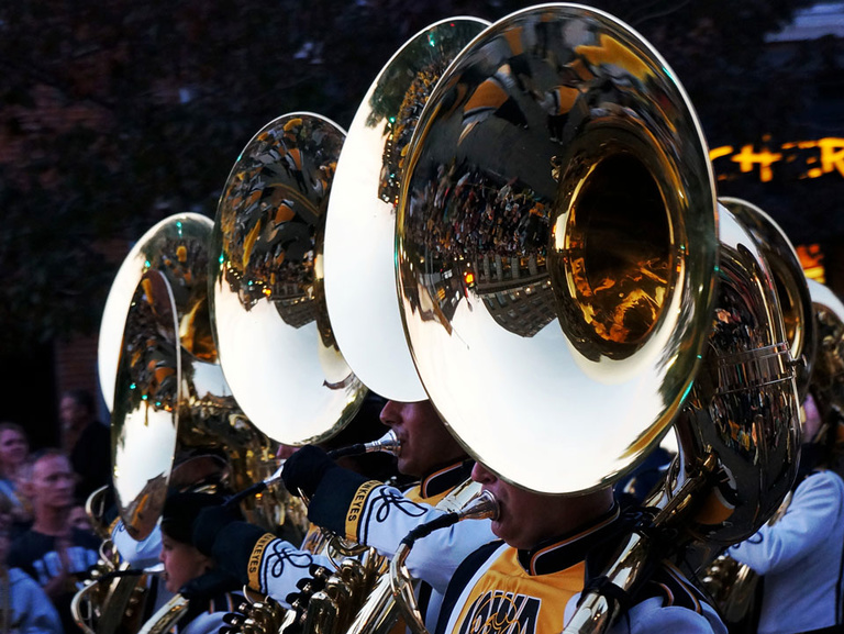 A closeup of tuba players in downtown Iowa City.