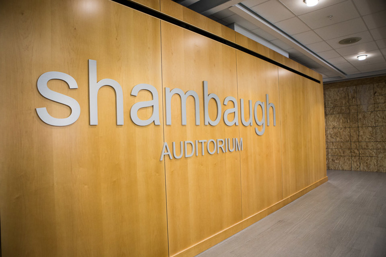 Wall with sign for Shambaugh Lecture Hall.
