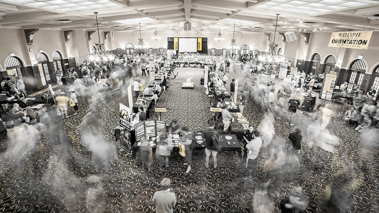 "Summer Orientation" by Chenzhe Zhu depicts the flurry of activity at an orientation event in the Iowa Memorial Union. The photo received first prize in the international student Exploring Local Cultures and Traditions category. Zhu is a cinema, French, a