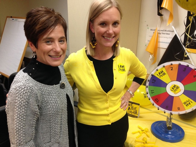 We Are Phil co-chair Joni Troester (left), UI Human Resource Services Director of Organizational Effectiveness/Health and Productivity, enjoyed a We Are Phil Carnival on Wednesday, 10/15, in the University Services Building with Megan Hammes, UI Wellness 