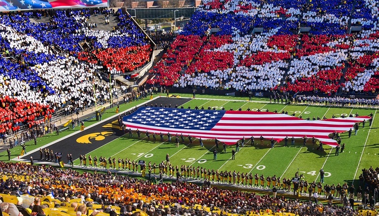 American flag on the field during card stunt