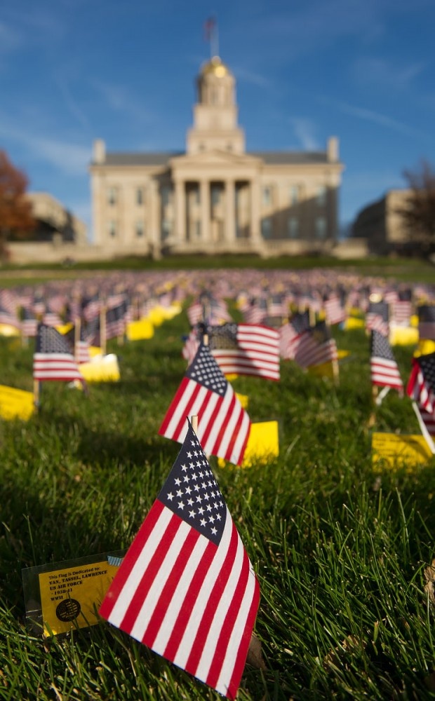 Flags adorn the Pentacrest in front of the Old Capitol