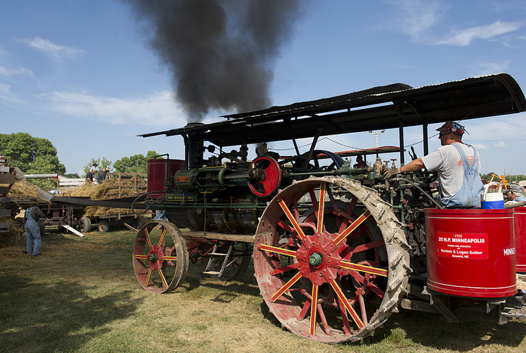 Steam-powered threshing demonstration.