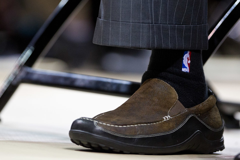 Don Nelson sports NBA socks at commencement