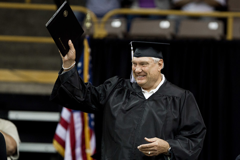 Don Nelson waves his diploma