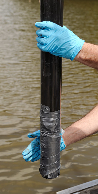 A core tube comes out of the water.