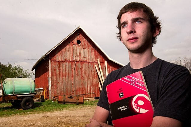 portrait of Tyler Finchum with barn in background