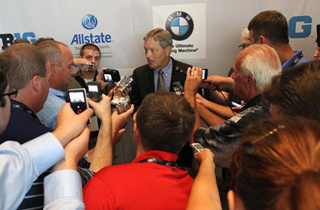 Kirk Ferentz surrounded by members of the media