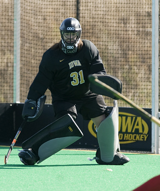 University of Iowa field hockey goalkeeper Kathleen McGraw keeps an eye on the action on the field