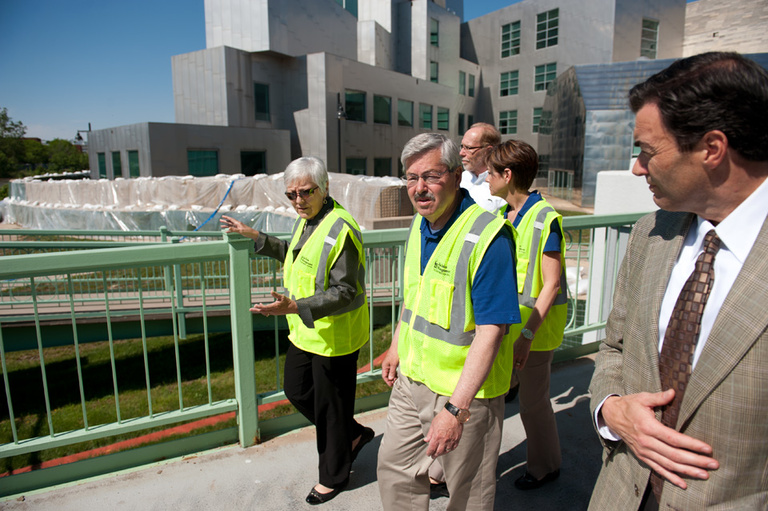 UI President Sally Mason leads officials on a tour of flood preparations.