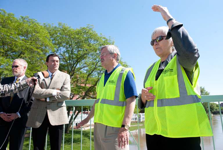 UI President Sally Mason leads officials on a tour of flood preparations.