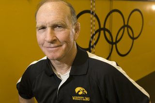 Dan Gable with Olympic rings in background
