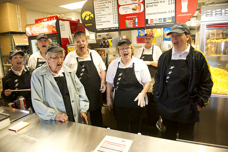 Sweet Adelines sing a song before opening their concession stand.