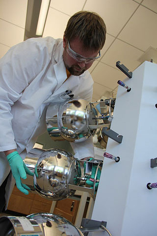 Matt Mainprize, environmental chemist, conducts air quality testing at the State Hygienic Laboratory.